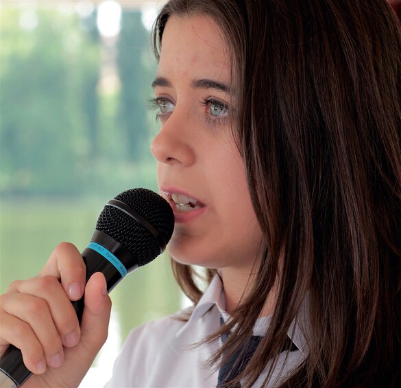 A person holding a microphone. 4