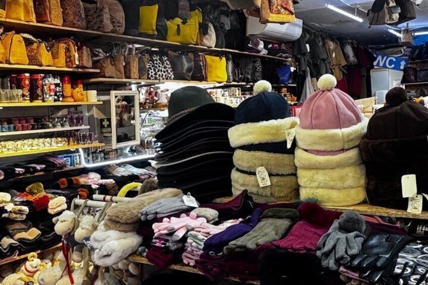 A market with various bags and accessories on display. 3