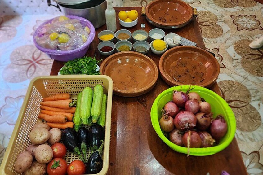 A table with various food items and cooking ingredients. 1