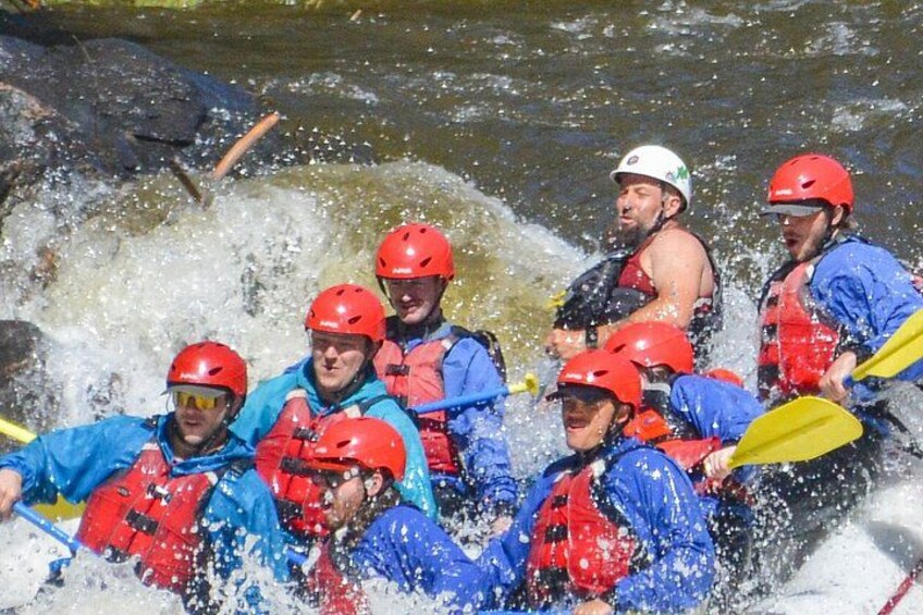 A group of people rafting in a river. 3