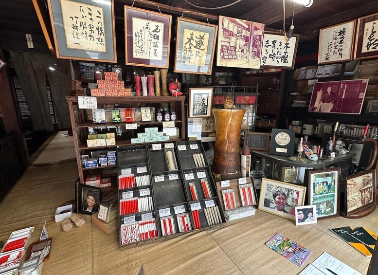 A bookstore with shelves of books and framed calligraphy. 4