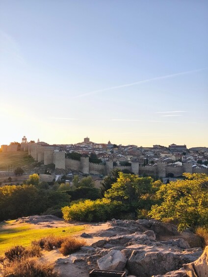 A historic city with a prominent castle and surrounding walls. 2