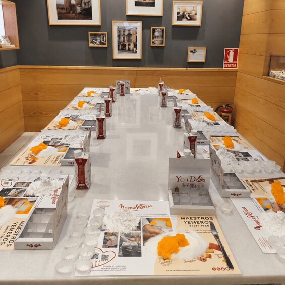 A display table with various food products and promotional materials. 2