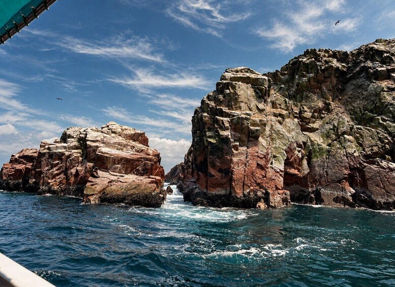 A rocky coastline with waves crashing against the rocks. 5