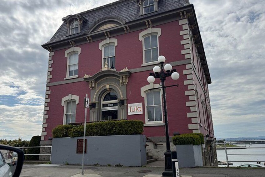 A red building with a sign that reads 'Tujia.' 4