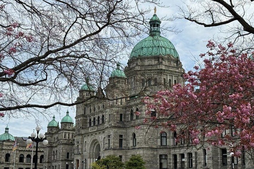 A historic building with a large green dome and arched windows. 3