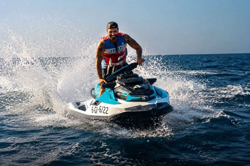 A person riding a jet ski on the water. 1
