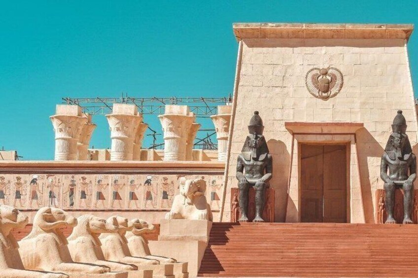 A temple with large statues and hieroglyphs. 5