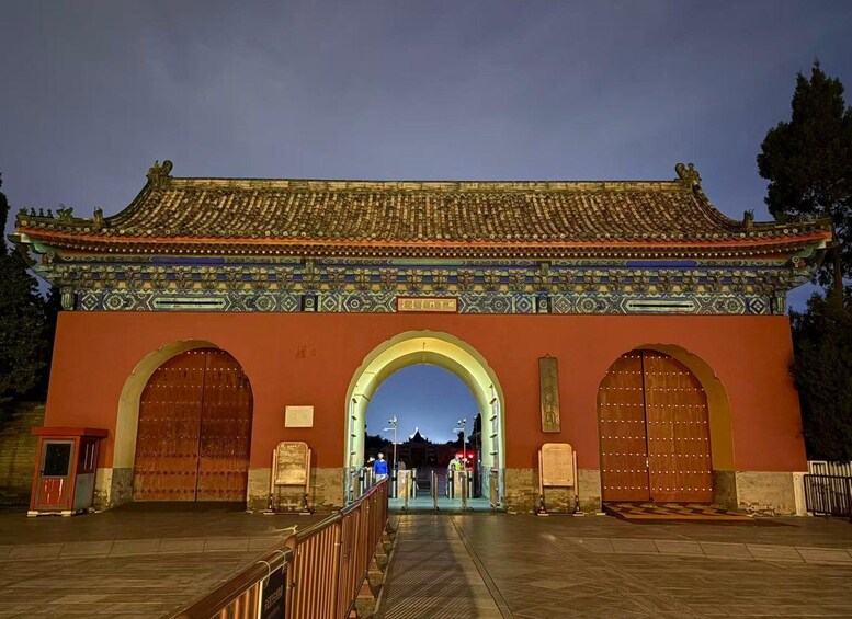 A traditional Chinese gate with ornate decorations and a tiled roof. 2