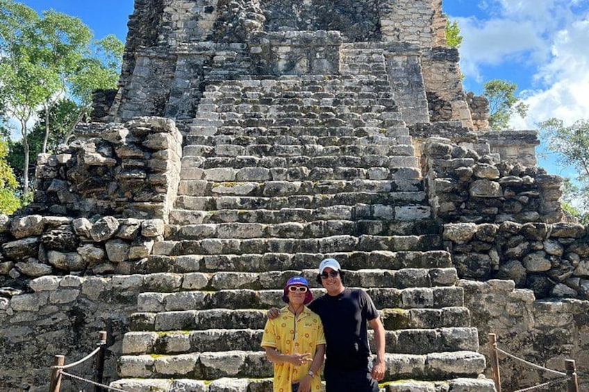 A stone staircase leading up to a pyramid-like structure. 2