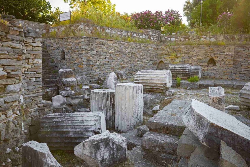 Ancient stone ruins with columns and walls. 4