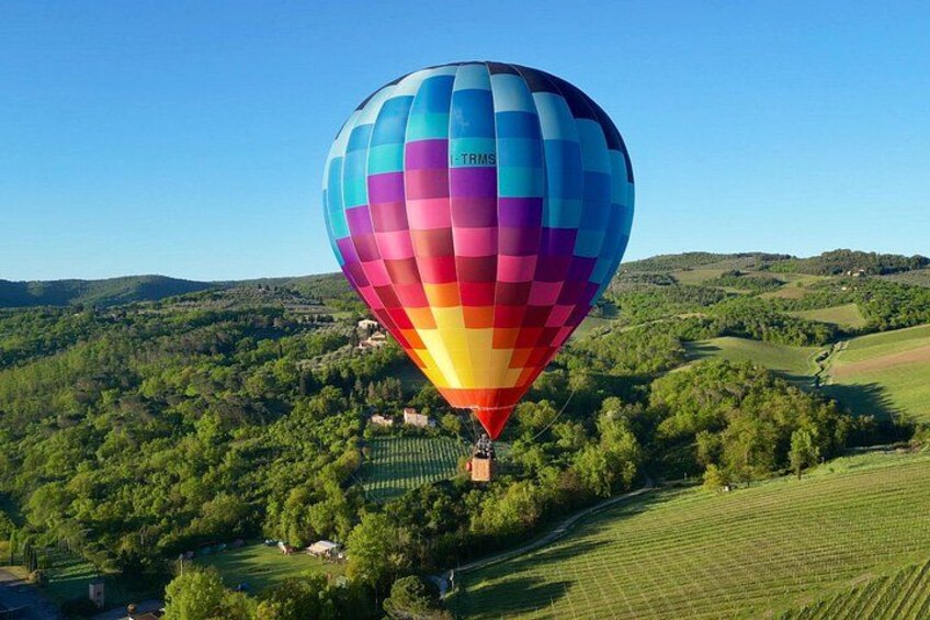 Soar above Tuscany’s rolling hills in the golden morning light. 1