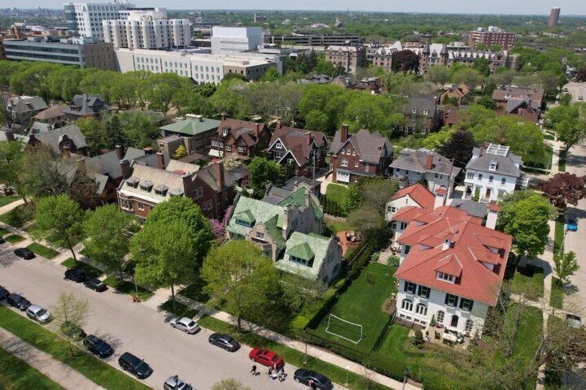 A residential area with houses, a soccer field, and a parking lot. 1