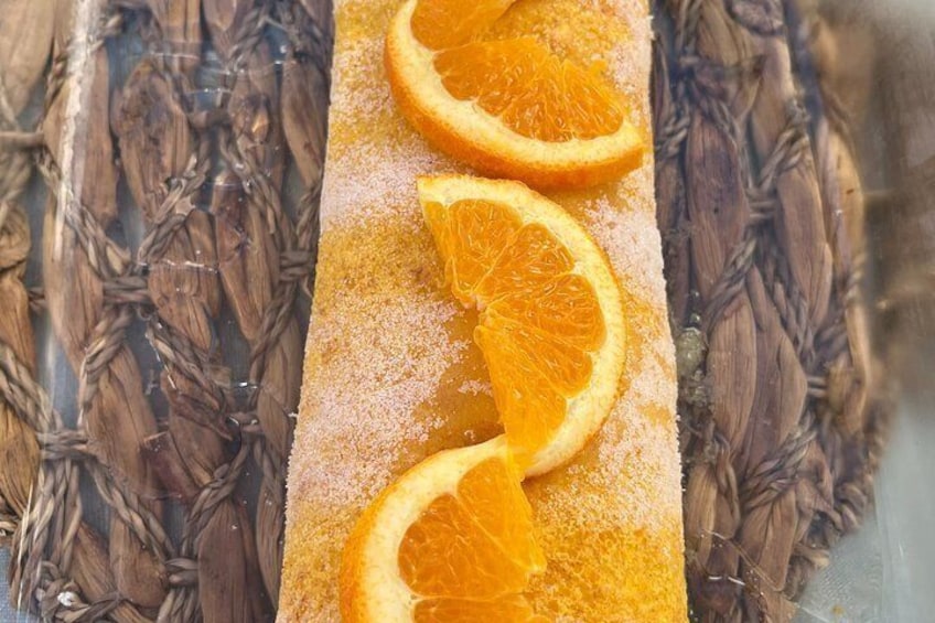 A rectangular object with orange slices and a textured surface. 2