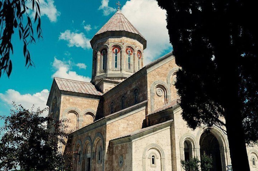 A church with a prominent dome and arched windows. 5