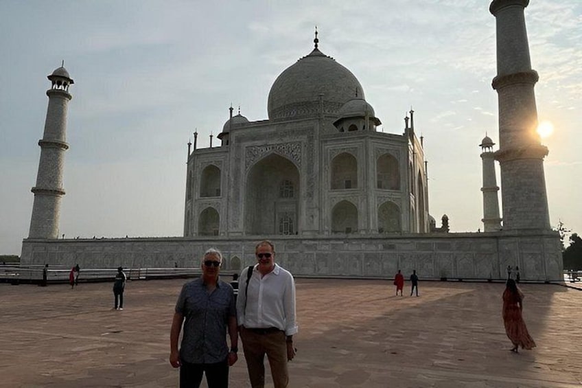 The Taj Mahal with two people standing in the foreground. 3