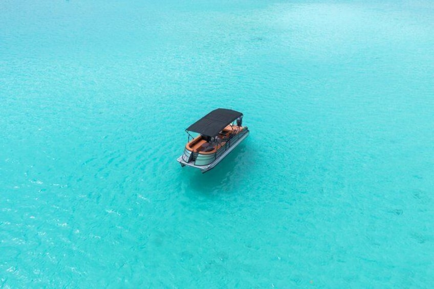 A boat on turquoise water. 3