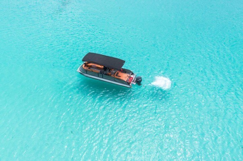A boat on turquoise water. 2