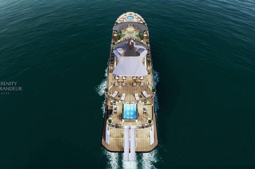 A large cruise ship with a swimming pool, sun loungers, and a covered deck area. 2