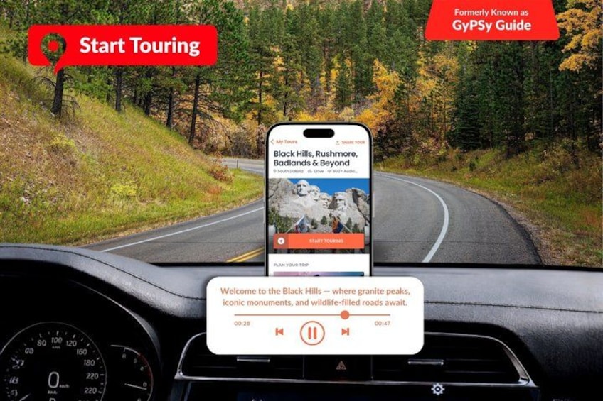 A smartphone displaying a travel guide app on a dashboard with a scenic road view. 1