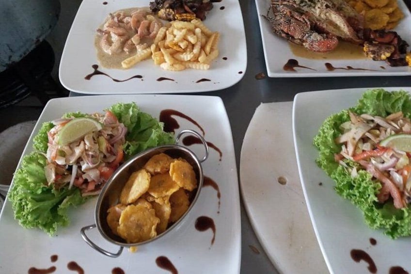 Three plates of food with different dishes including seafood, fries, and salads. 5