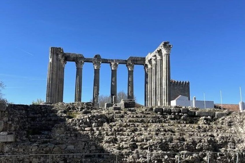 Ancient ruins with columns and stone steps. 5