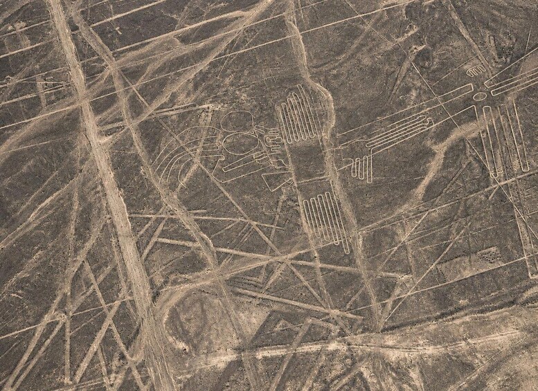 A satellite view of a landscape with intersecting linear patterns, possibly roads or agricultural fields. 3