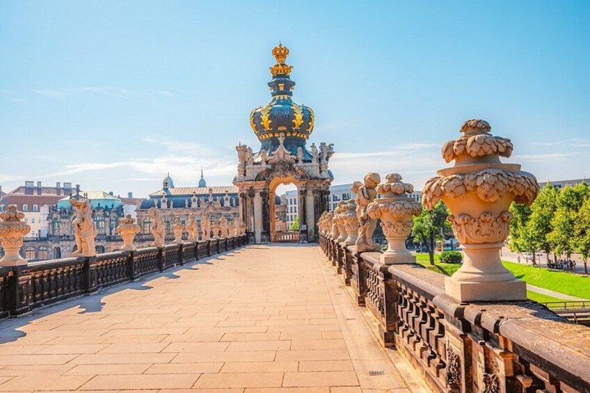 A grand bridge with ornate balustrades and a central archway. 2