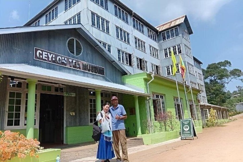 A building with a sign reading 'CEY:ON TEA MUSEUM' and a green awning. 5