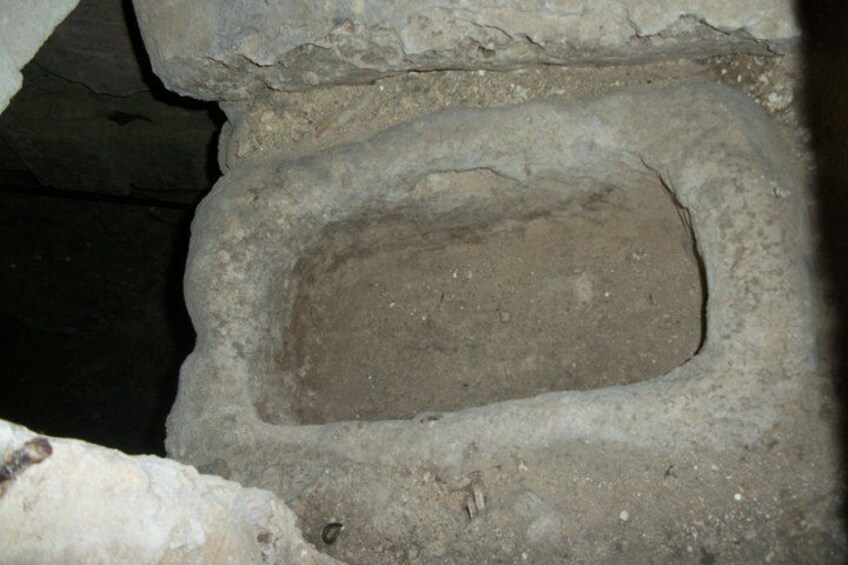 A stone structure with a rectangular opening. 3
