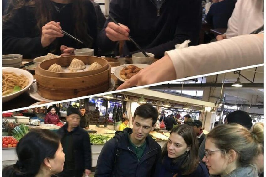 People eating dumplings and vegetables at a market. 1