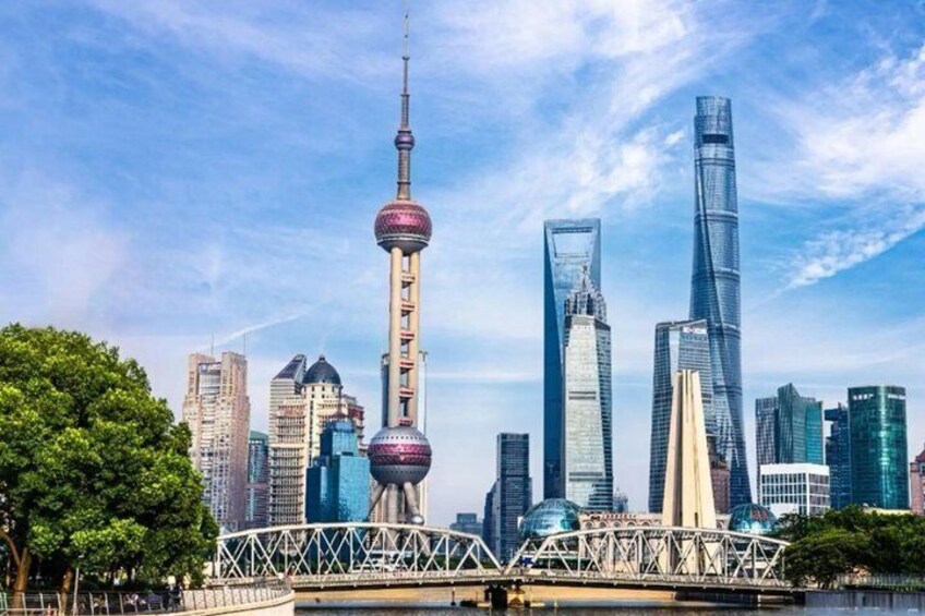 A city skyline with modern skyscrapers, including a distinctive tower with a spherical observation deck. 5