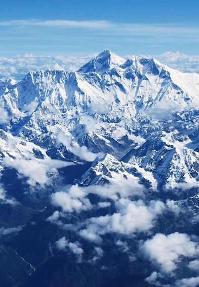 A snow-covered mountain range with peaks and valleys. 4
