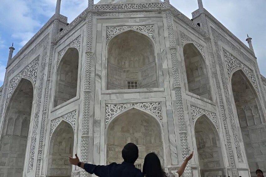 A large white marble building with multiple arches and intricate carvings. 3