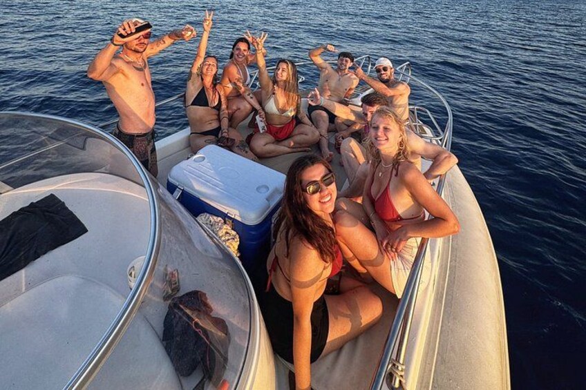 A group of people on a boat in the water. 3
