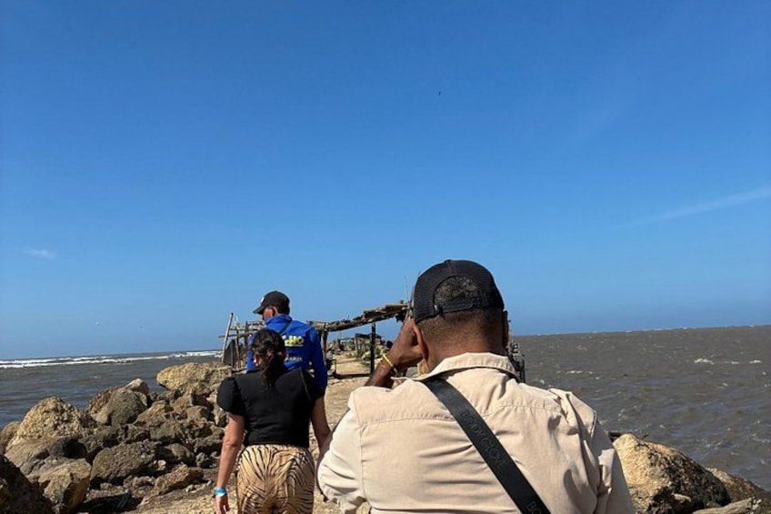 A rocky shoreline with a clear sky. 2