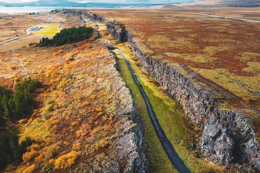 A rugged landscape with a narrow path winding through a rocky terrain. 3