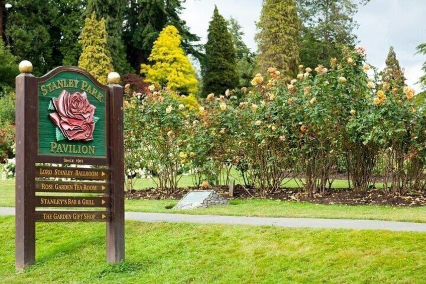 A sign for Stanley Park Pavilion with directions to the Lord Stanley Ballroom, Rose Garden Tea Room, Stanley's Bar & Grill, and The Garden Gift Shop. 4