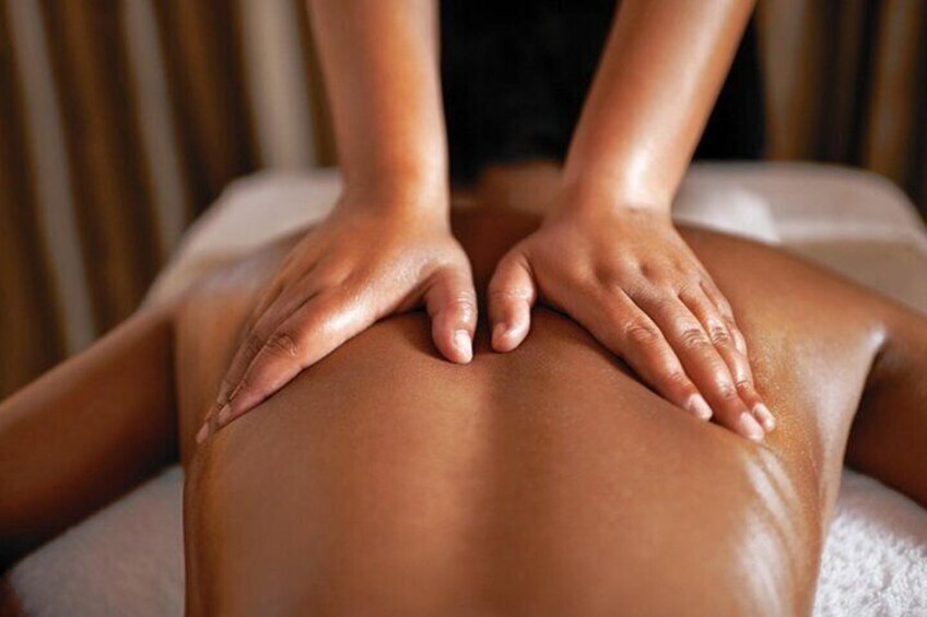 A person receiving a back massage. 1