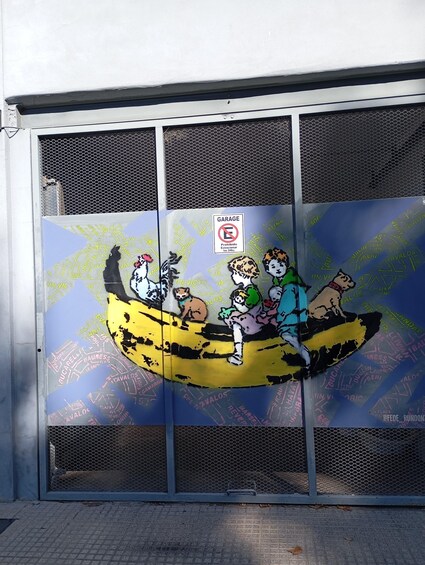 A mural of cartoon characters on a yellow boat with a 'No Parking' sign. 4