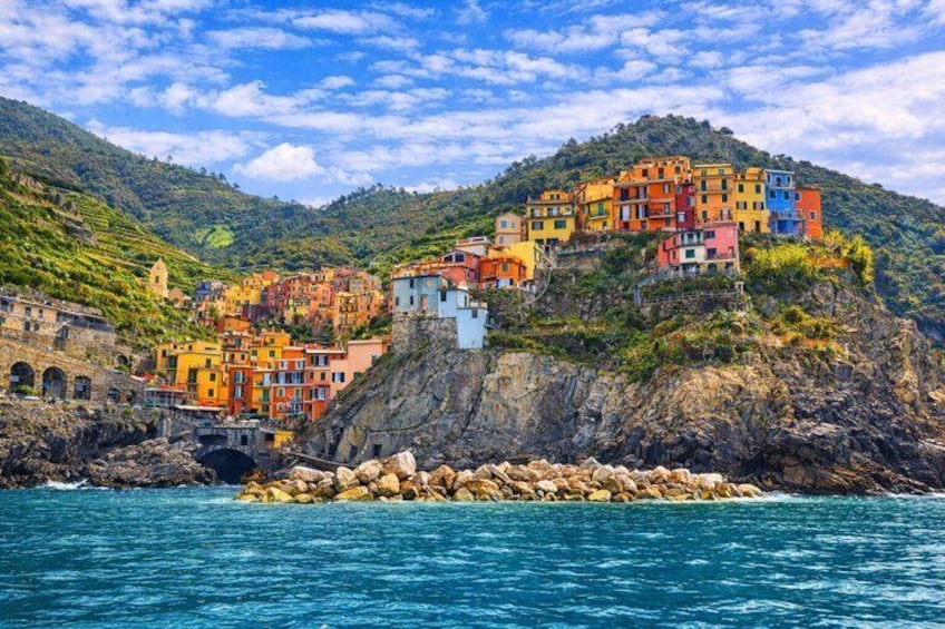 Colorful buildings on a hillside by the sea. 1