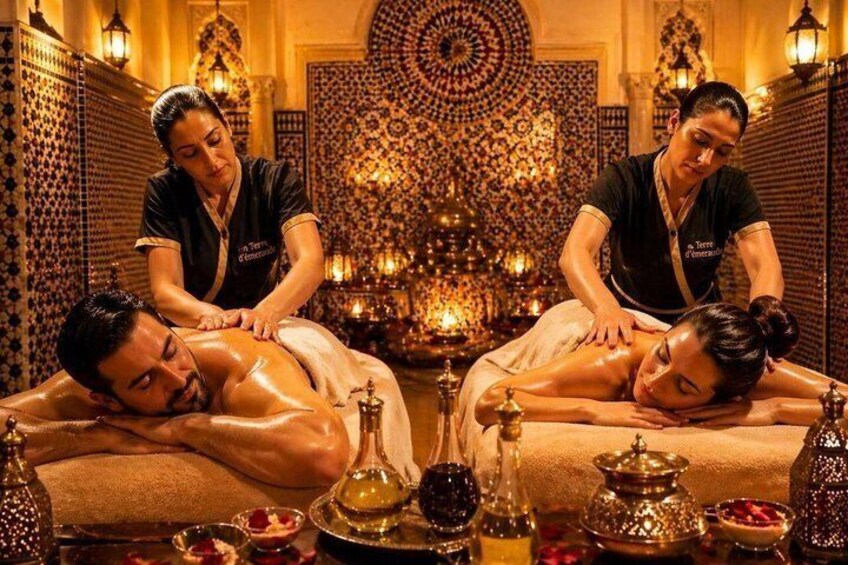 A traditional spa setting with two clients receiving massages, surrounded by ornate decor and traditional Moroccan elements. 1