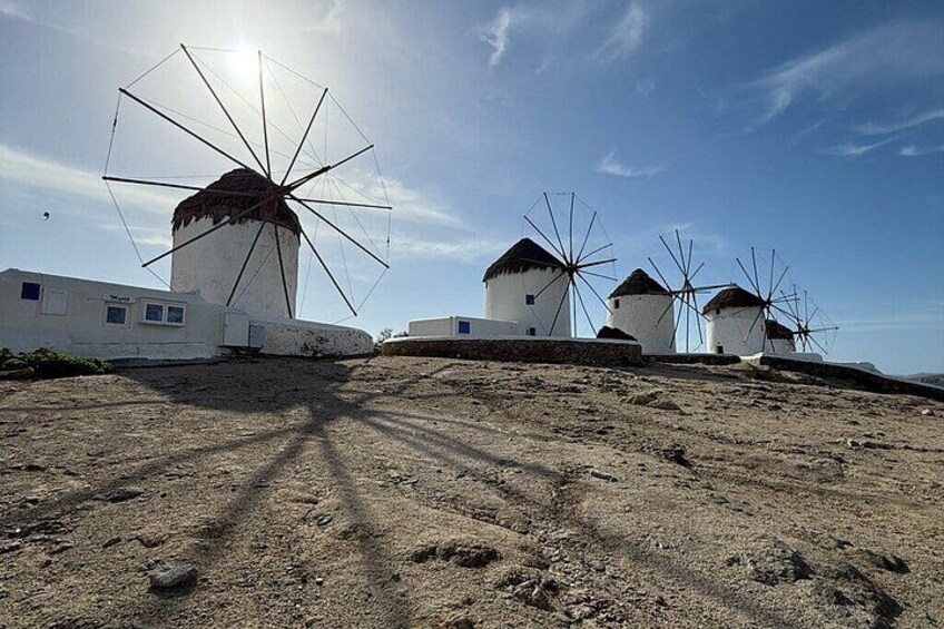 Windmills on a hill with a clear sky. 5