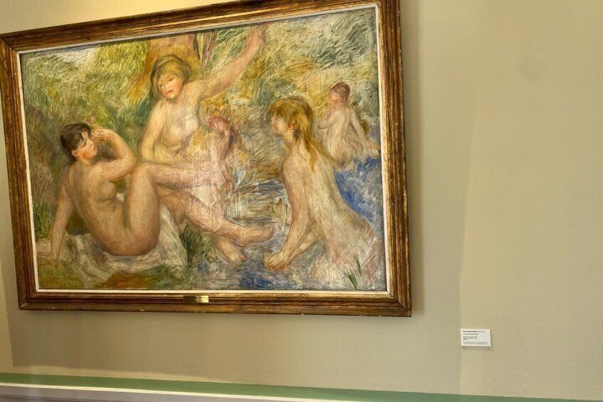 A classical painting with figures in a natural setting, framed and hung on a wall. 2