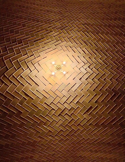 A circular brick pattern with a central light fixture. 3
