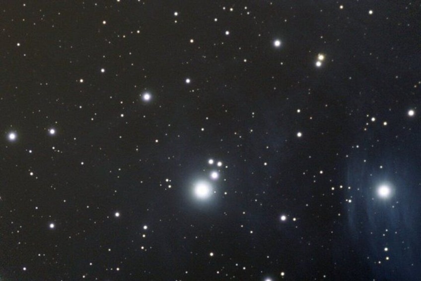 A starry night sky with numerous visible stars and a bright celestial object. 2
