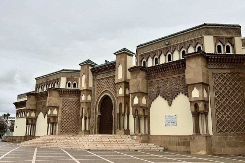 A large, historic building with intricate arches and detailed stonework. 4