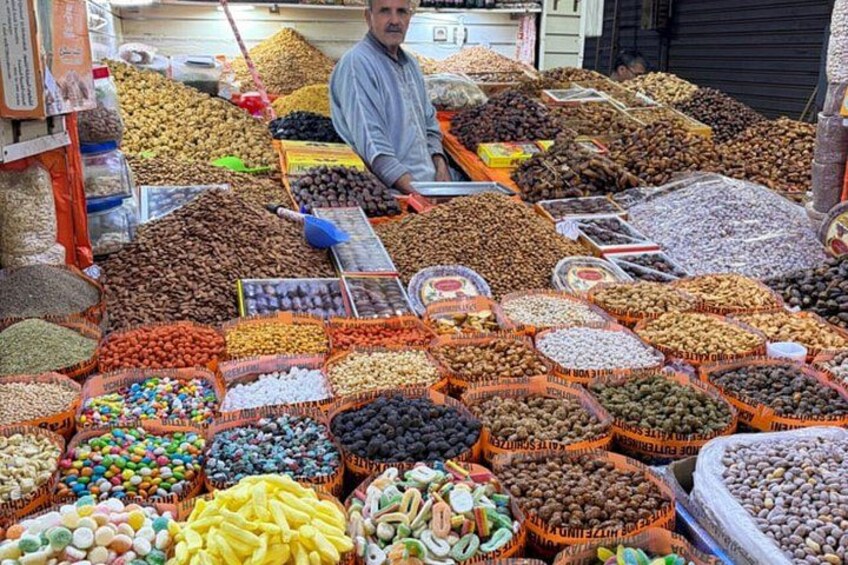A market stall with various nuts and dried fruits. 2
