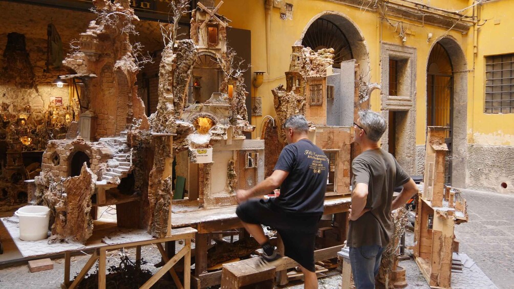 A workshop with intricate wood carvings and sculptures. 5