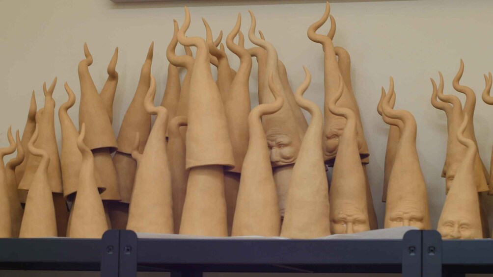 A collection of sculptural objects with elongated, twisted shapes. 1